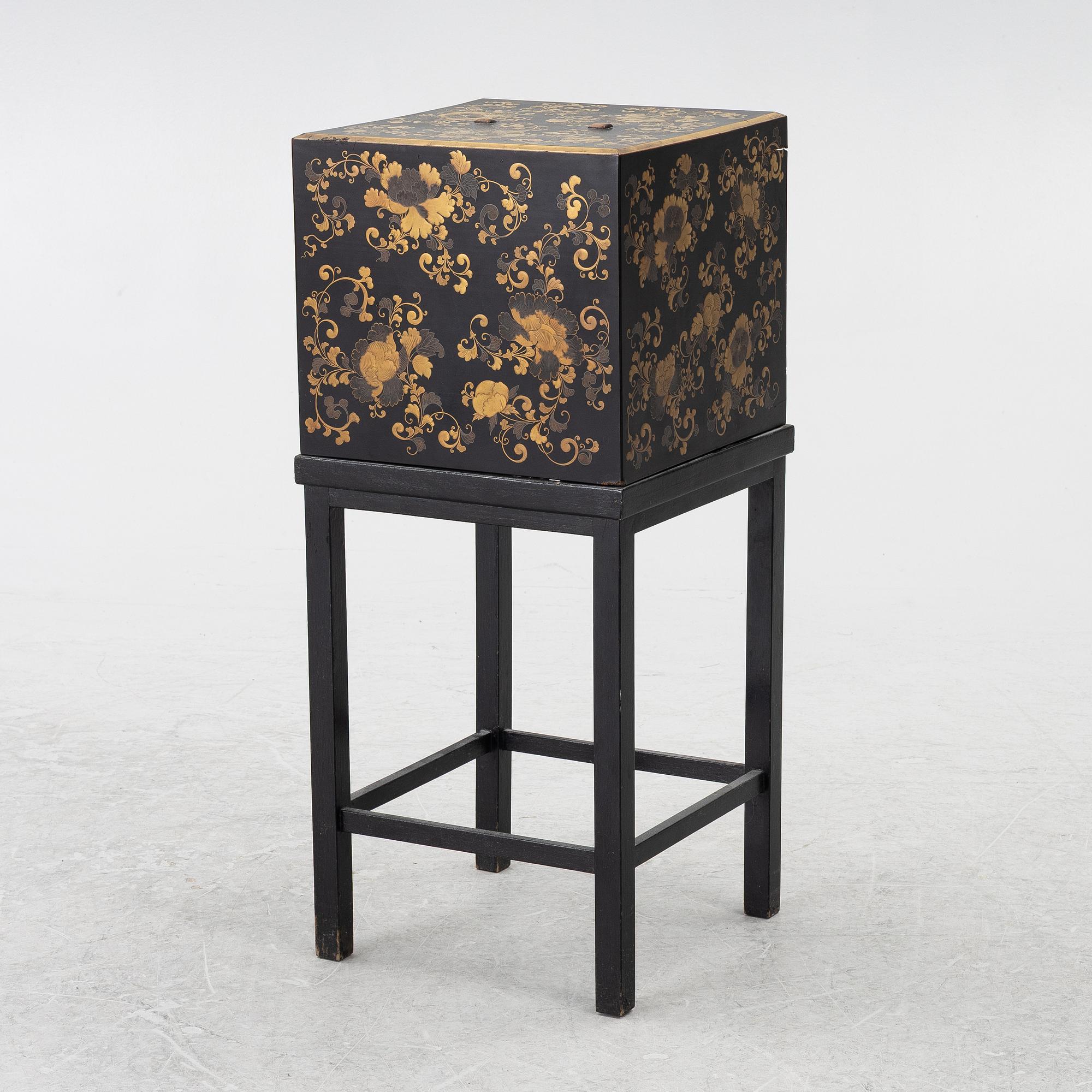 A lacquered end table/box with stand, Japan, 20th century.