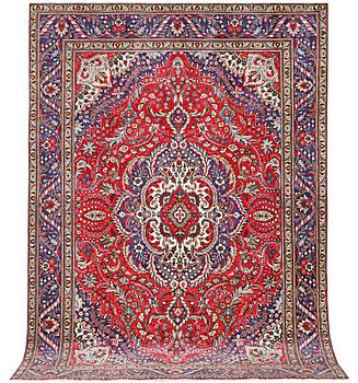 A Tabriz carpet, c. 335 x 236 cm.