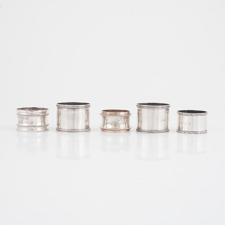 A set of five silver napkin rings, including Russia, circa 1900.