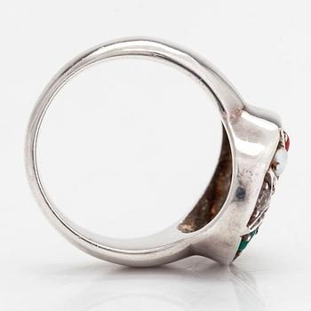 A sterling silver ring with multicoloured precious stones.