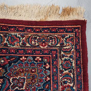 A CARPET, a semi-antique Mashad, ca 400-404 x 314 cm.