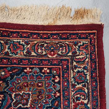 A CARPET, a semi-antique Mashad, ca 400-404 x 314 cm.