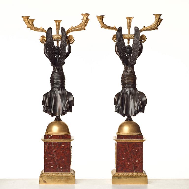 A pair of important five light Empire candelabra.