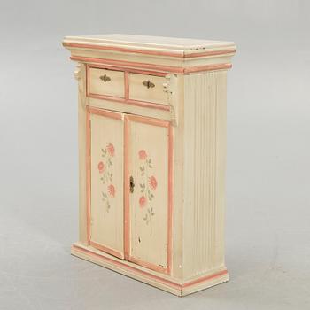 An 18th century painted cabinet.