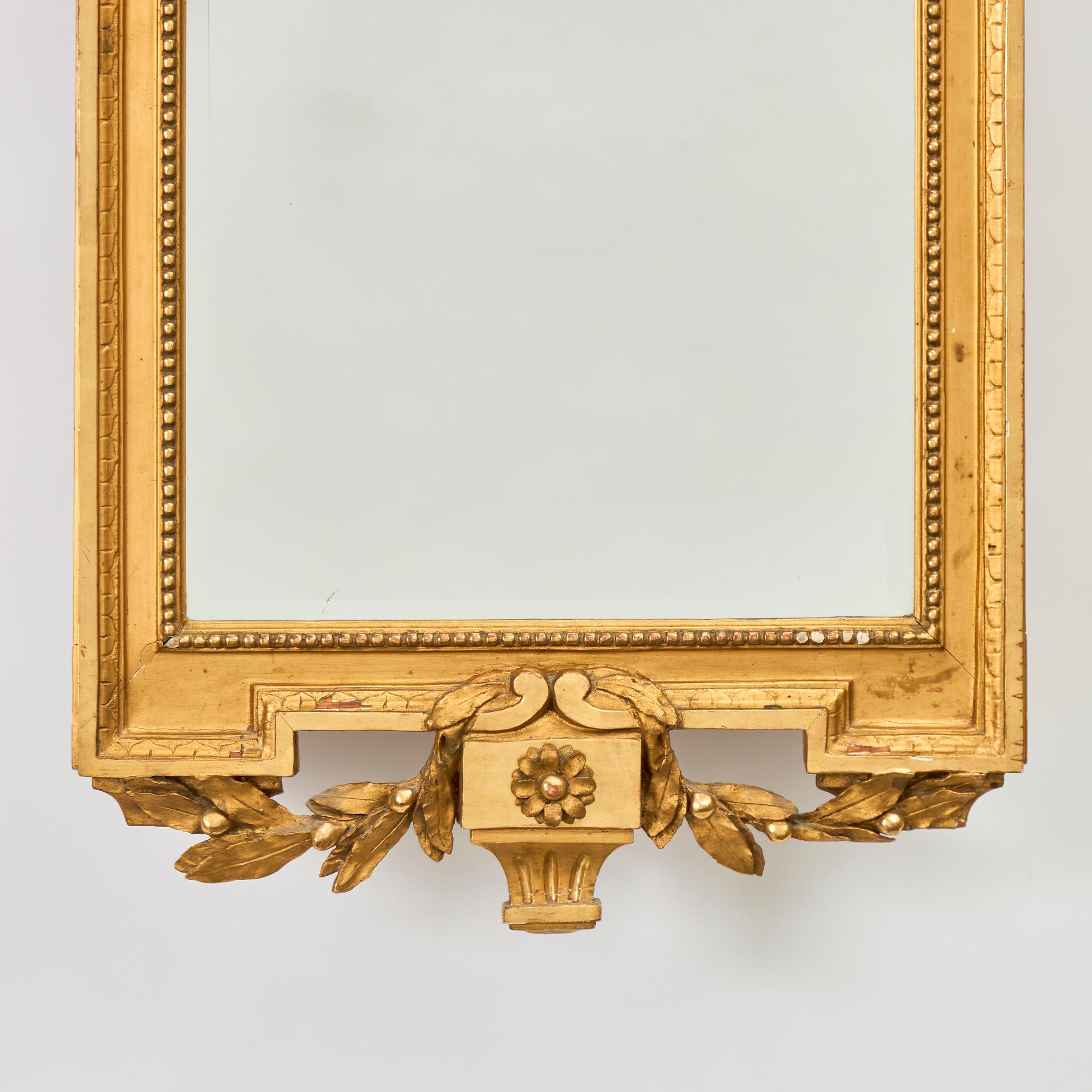 A Gustavian giltwoos mirror by J. Åkerblad (master in Stockholm 1758-99).