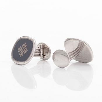 Patek Philippe, a pair of 18K whitegold 'Calatrava' cufflinks.