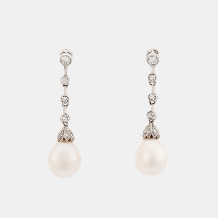 A pair of platinum and pearl earrings set with round brilliant- and eight-cut diamonds.