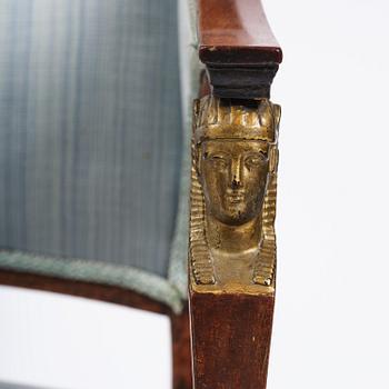 A pair of late Gustavian mahogny armchairs.