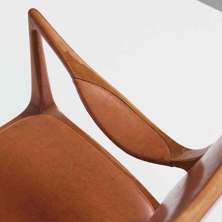 Hans Asplund, a walnut and leather easy chair, Nordiska Kompaniet, ca 1955, for the Nordiska Kompaniet beauty salon.