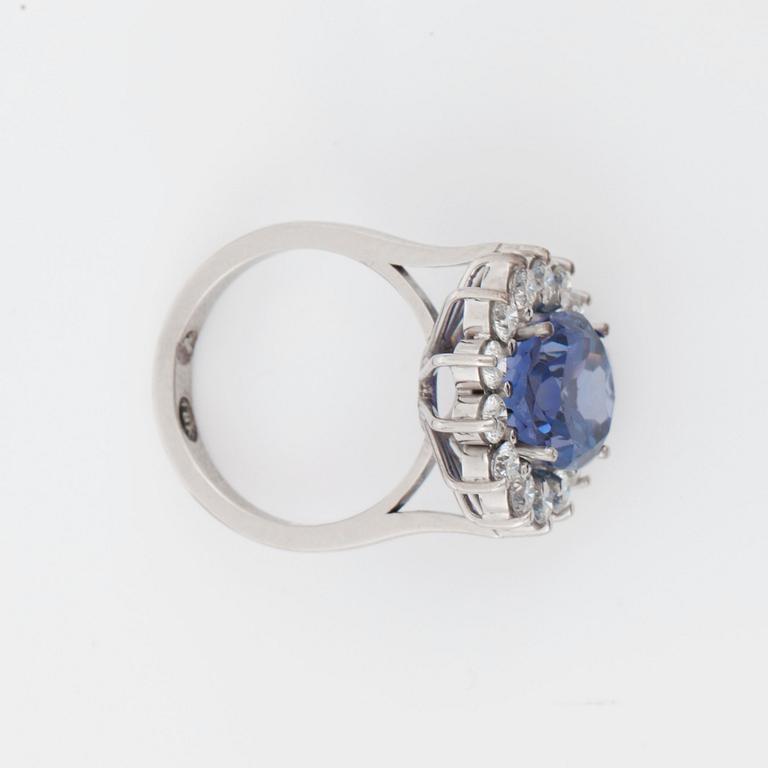 A tanzanite 6.80 cts and brilliant-cut diamond, 1.40 cts G/VS, ring.