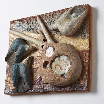 Tyra Lundgren, a stoneware relief 'Reclining pecock dove', Sweden 1950-60's.