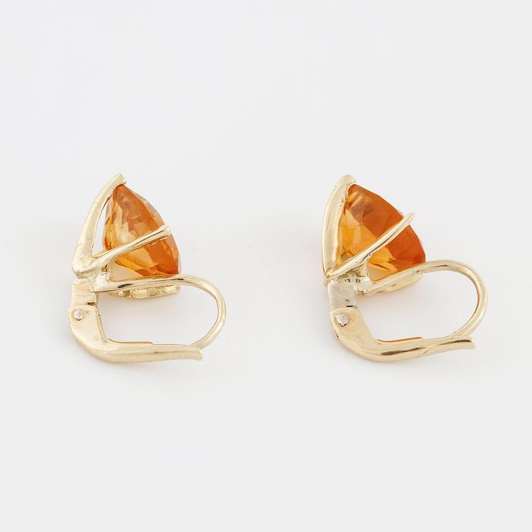 A pair of citrine earrings.