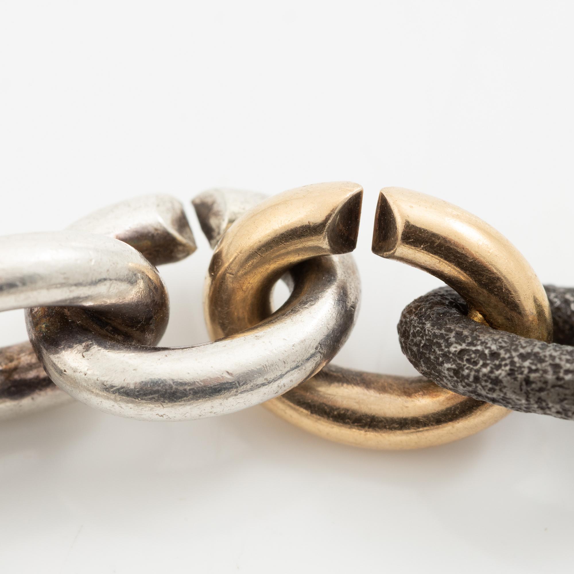 Mikael Hamma, a bracelet 18K gold, sterling silver and oxidised iron, Stockholm 1996.