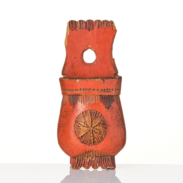 A Swedish folk art carved and painted spoon holder, 18th century.