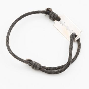 Bracelet, Dinh Van, textile and 18K white gold.