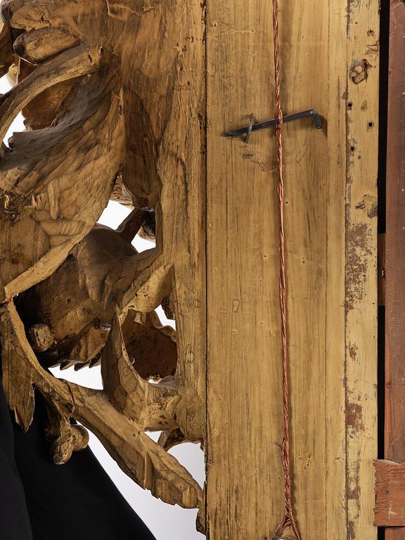 A presumably Dutch Louis XIV carved giltwood frame with mirror glass, in the style of Jean Le Pautre, late 17th century.