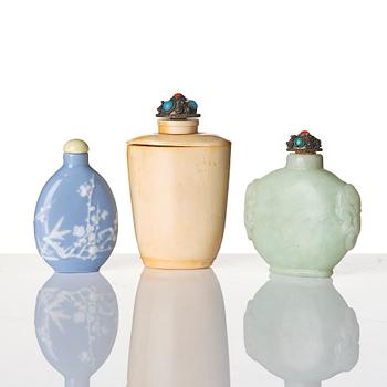 A group of three Chinese snuffbottles, stone, glass and bone, late Qing dynasty / around 1900.