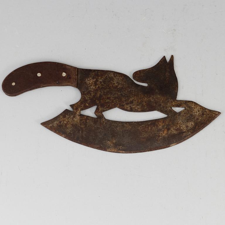 A 19th century iron meat cutter.