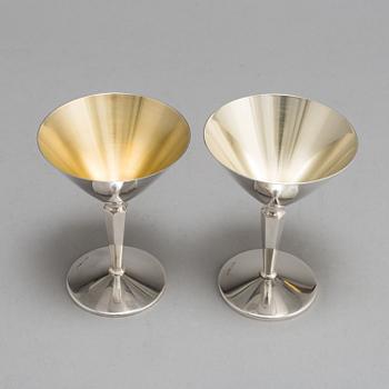 A SET OF 14 SILVER COCKTAILGLASSES, 1960s.