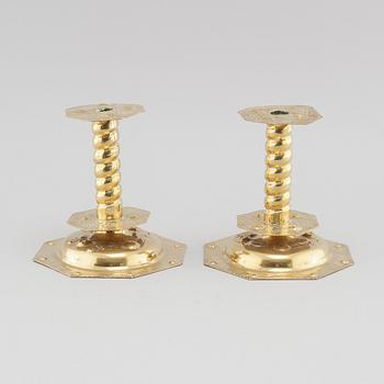 A pair of brass baroque style candlesticks, 20th century.