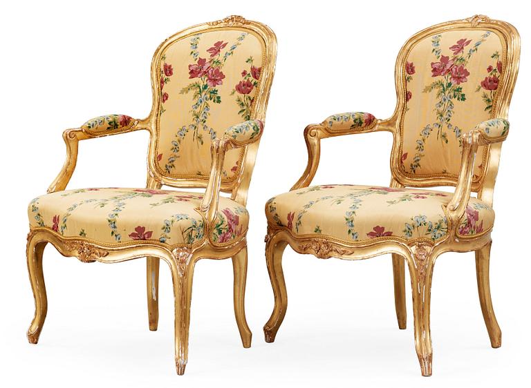 A pair of Louis XV 18th century armchairs, possibly by Claude-Etienne Michard.