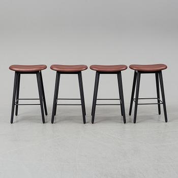 Four contemporary leather upholstred stools by Berlin & Iskos for Muuto.