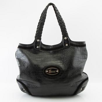 Gucci,.