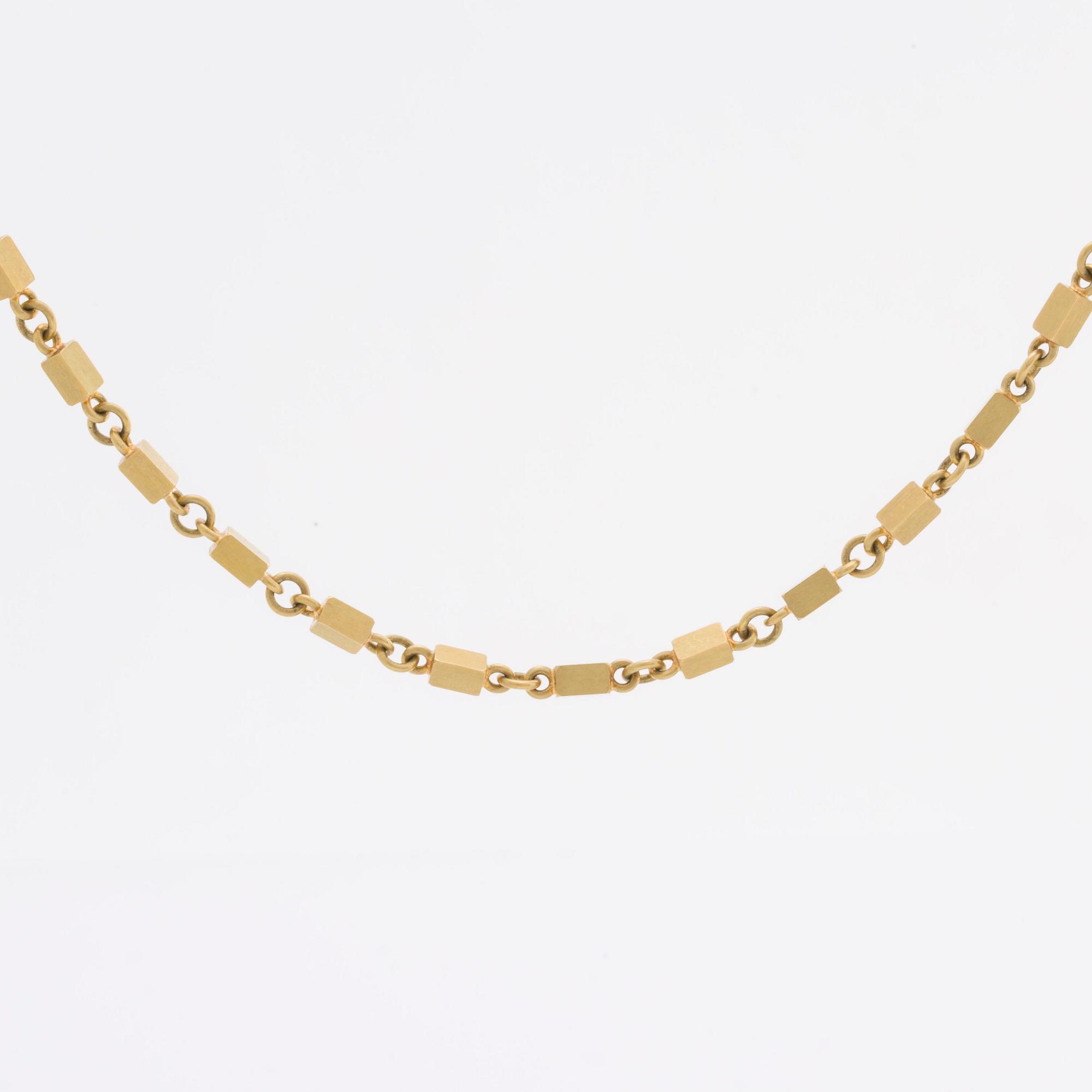 WIWEN NILSSON COLLIER 18K guld mindre stavar och ringar, Lund 1970, original etui.