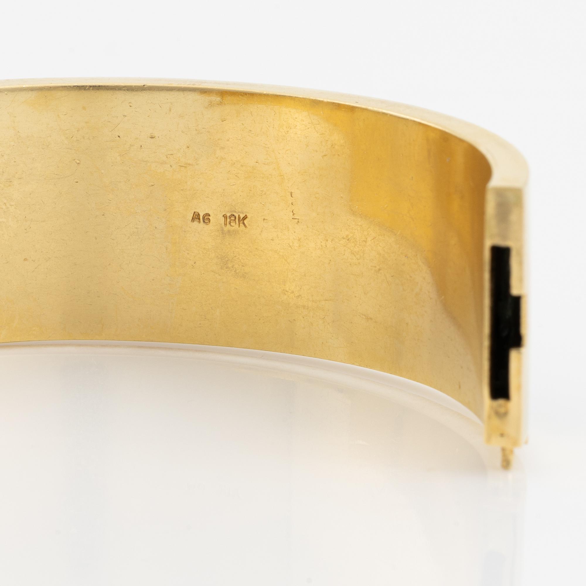 A Black Starr & Frost bracelet and a pair of earrings.