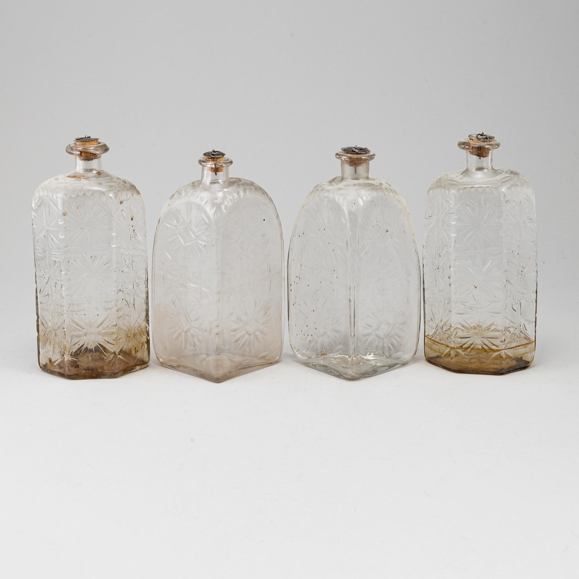 A gustavian style mahogany box with 4 glass bottles, circa 1900.