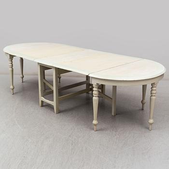 A 19th century dining table in three parts.