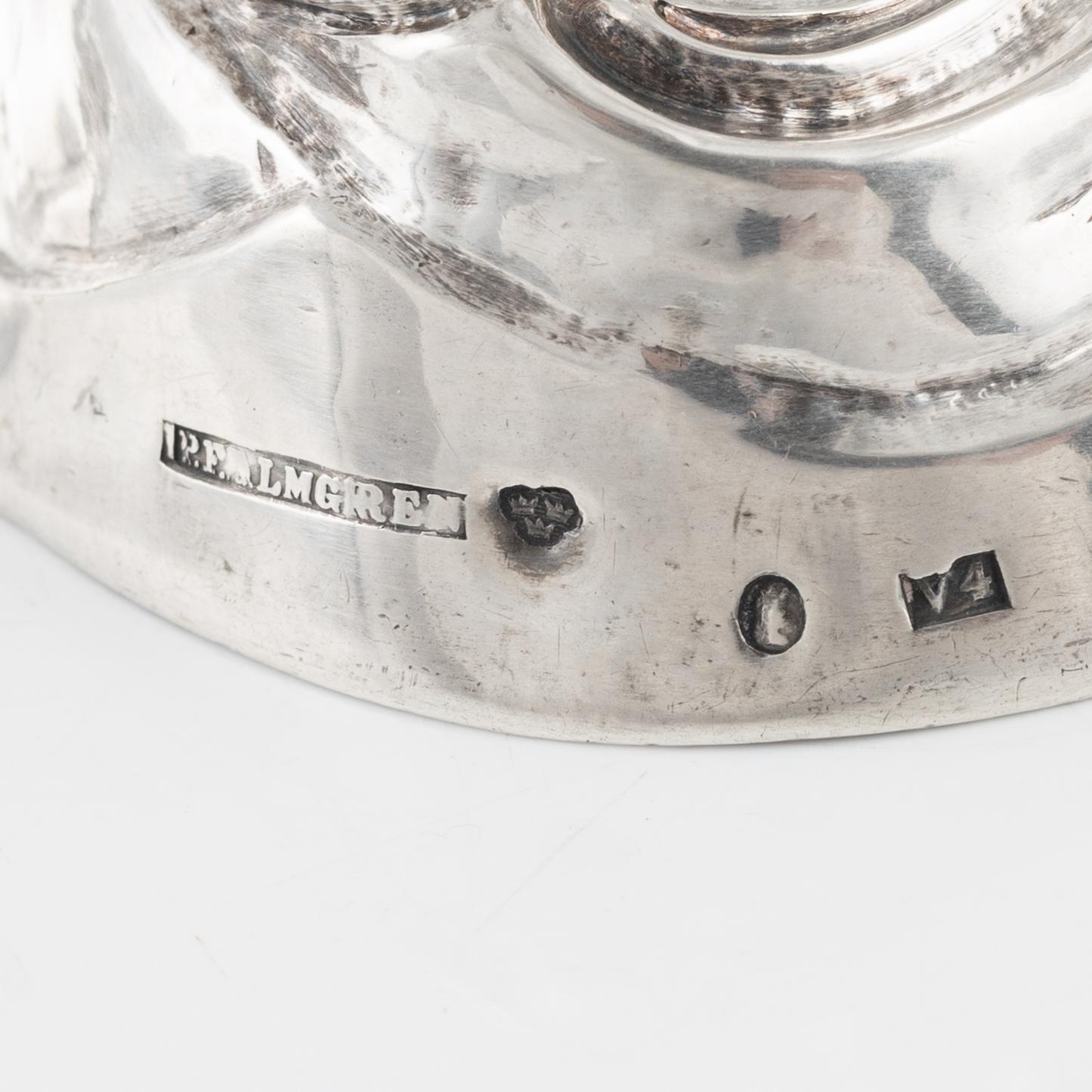 A pair of rococo style silver candle sticks by Pehr Fredrik Palmgren, Stockhom 1851.