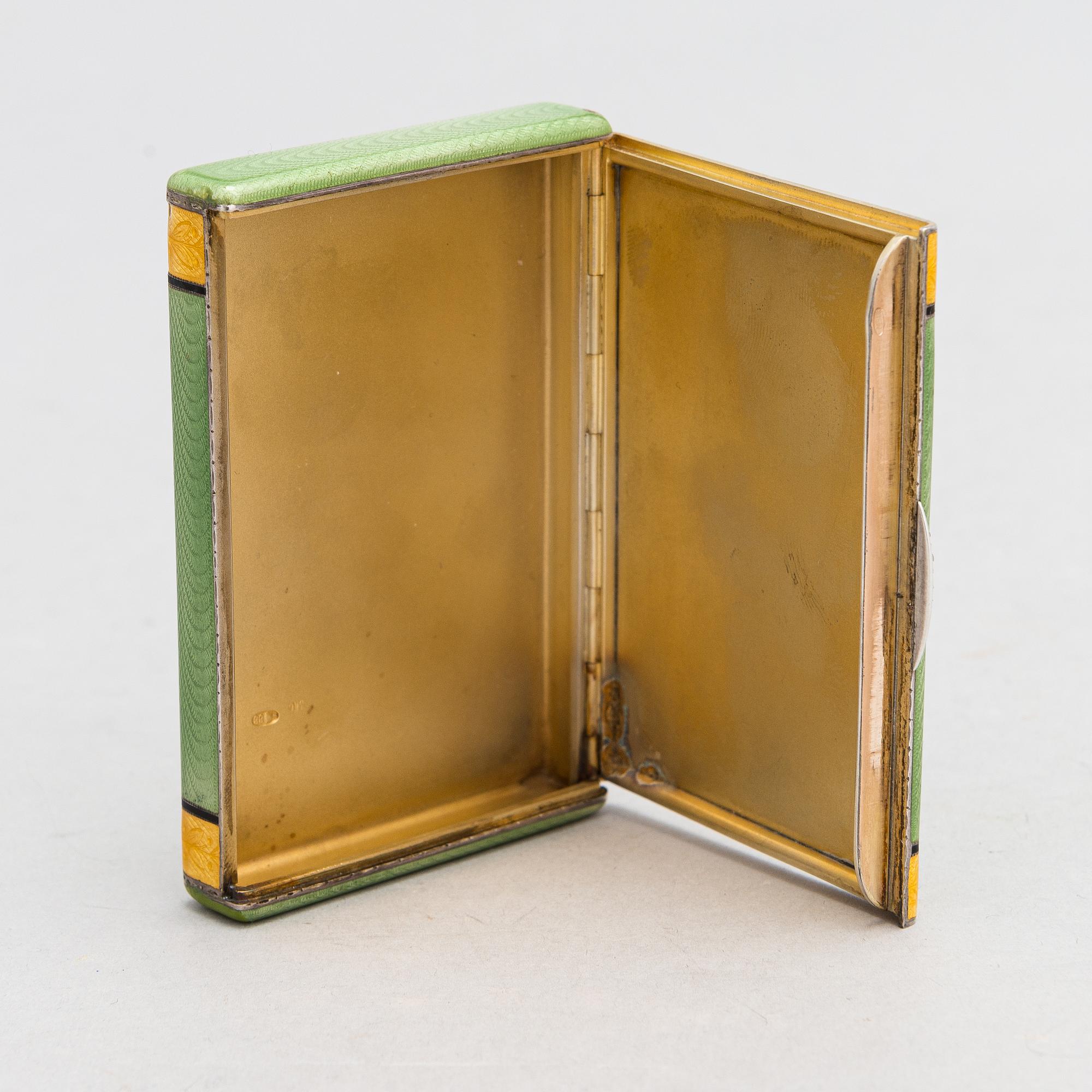 A gilded silver cigarette case with enamel and rose-cut diamonds. Moscow, early 20th century.