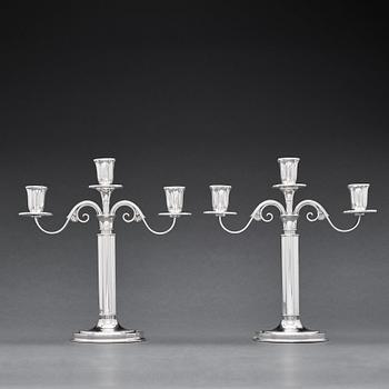 W.A Bolin, a pair of two branched silver candelabra, Stockholm 1935.