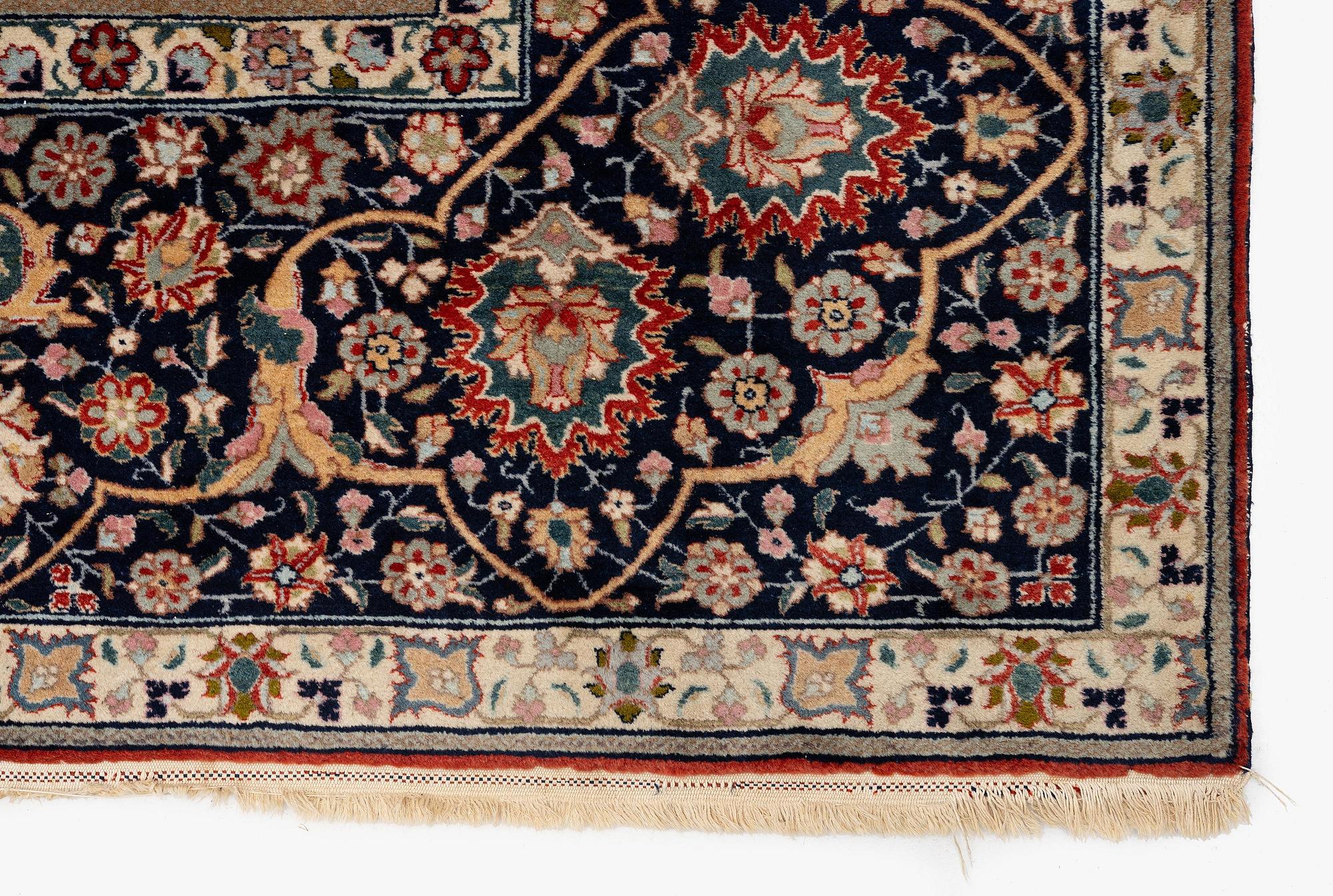 A semi-antique Benlian Tabriz carpet of 'Coronation' design, signed Jabarzade, c. 488 x 367 cm.