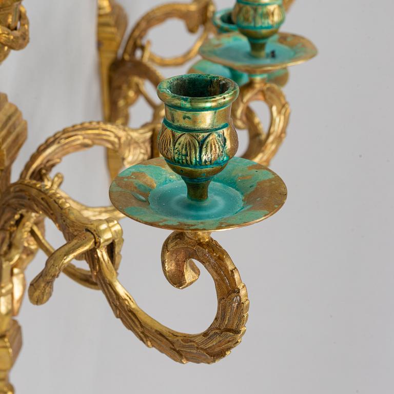 A pair of wall sconces, Louis XVI style, early 20th century.