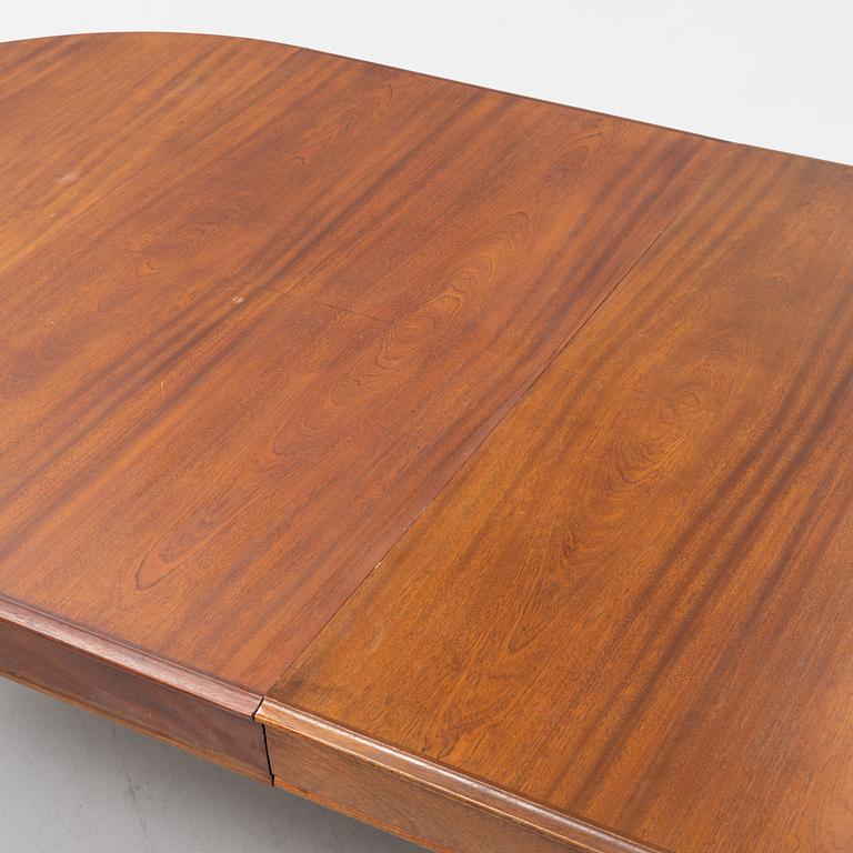 A mahogany rococo style dining table, 19th Century.