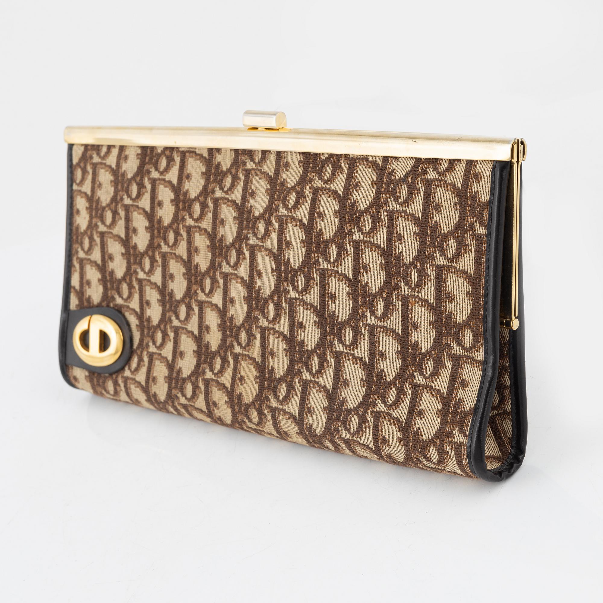 Christian Dior, a canvas clutch.