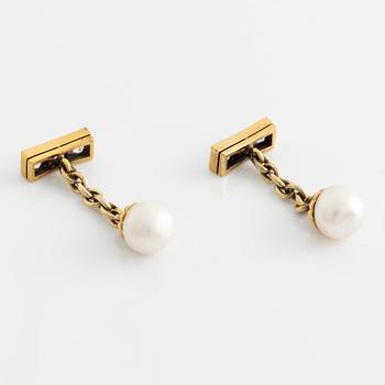 A pair of jewelled, pearl and gold Imperial presentation cufflinks by Constantine Nicholls Ewing, St Petersburg ,