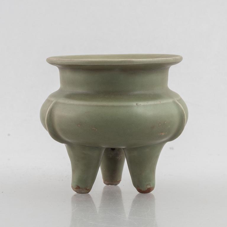 A Chinese celadon tripod censer, late Ming dynasty, for the Southeastern market.