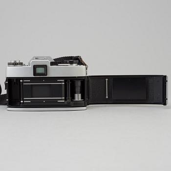 A chrome Leicaflex SL no nr  from 1284957 1971 with a black Elmarit-r  1:2.8 /135 lens no 2844073.