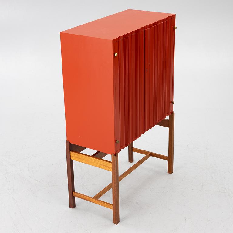 Josef Frank, a red lacquered cabinet, model 2192, 'The Cardboard Cabinet' by Svenskt Tenn, after 1985.