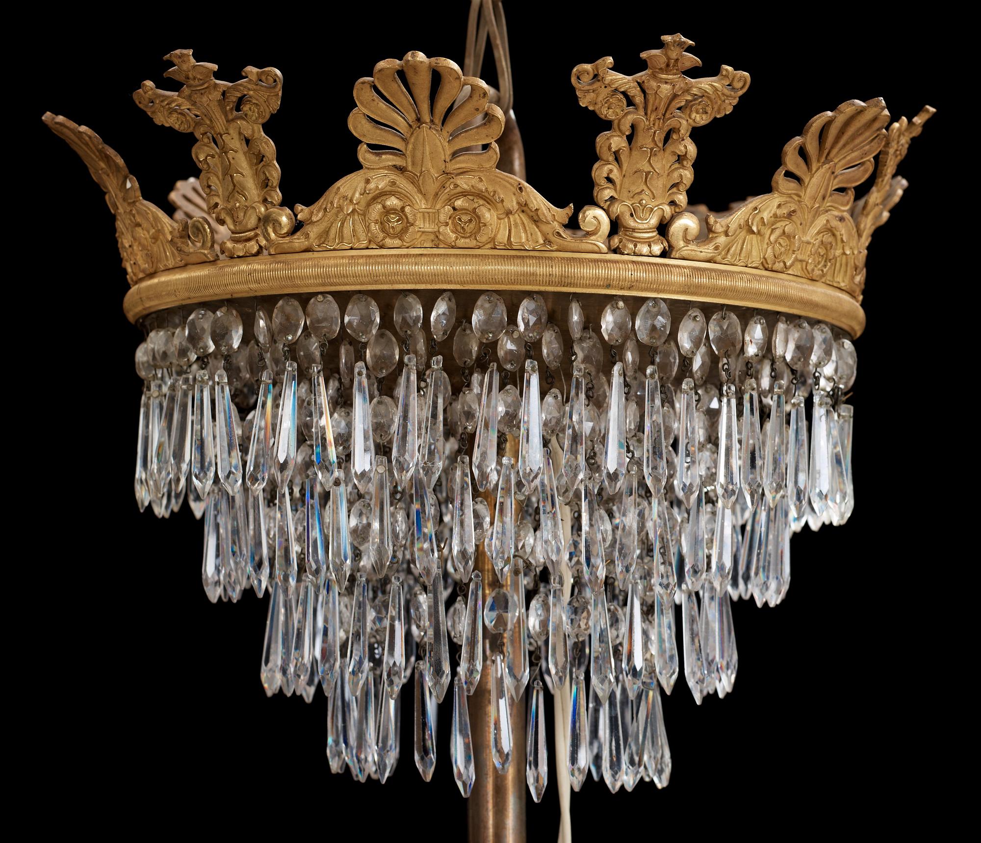 An Empire first half 19th century eighteen-light gilt bronze chandelier.