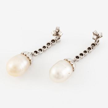 A pair of earrings in 18K white gold with cultured South Sea pearls and round brilliant-cut diamonds.