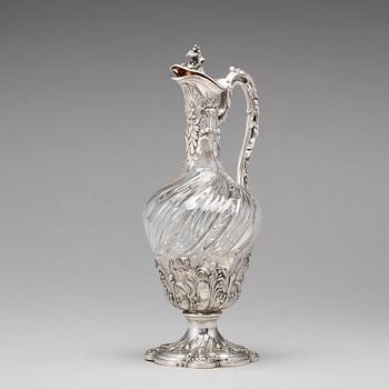 A French mid 19th century parcel-gilt silver and glass wine-jug.