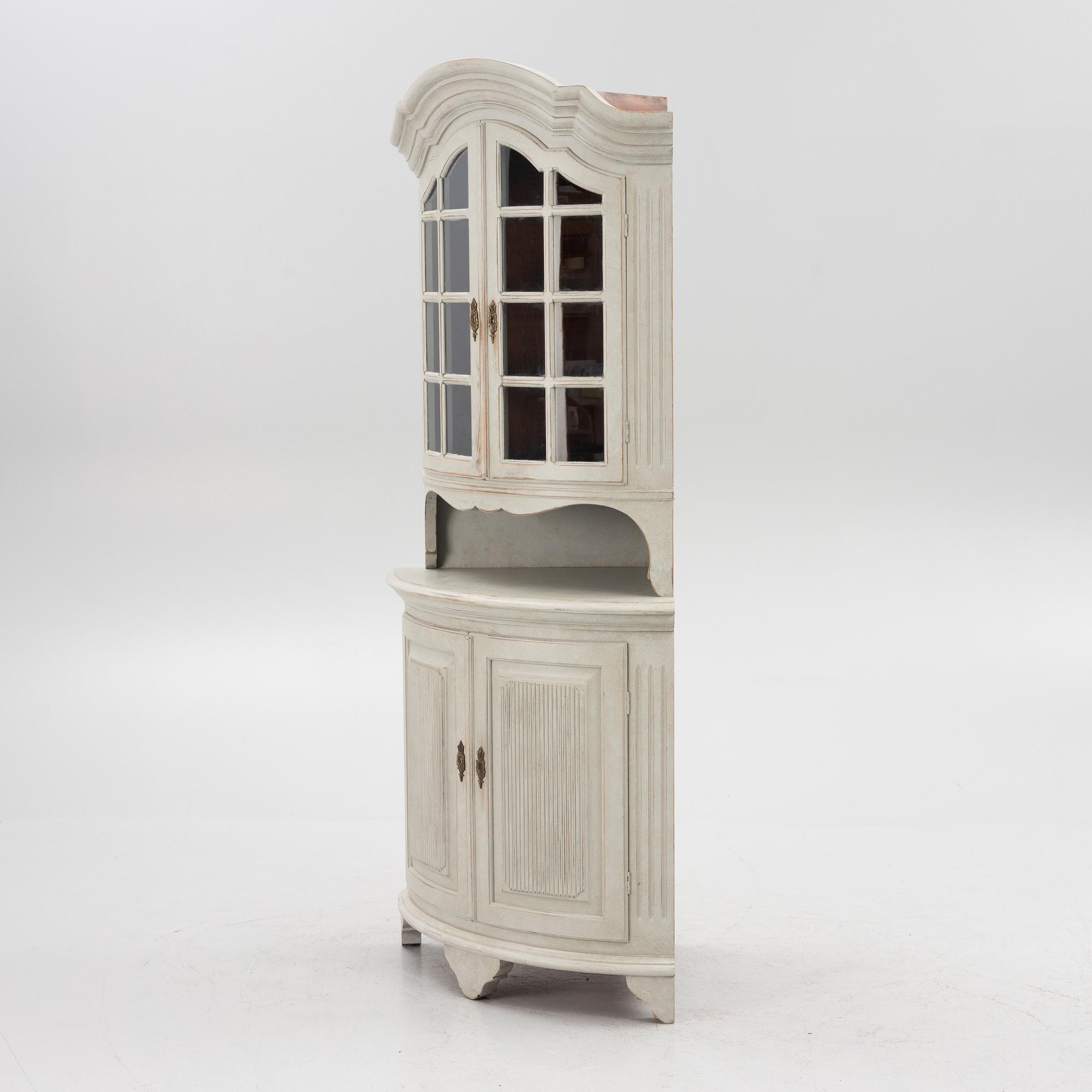 A Gustavian style 20th century corner cabinet.