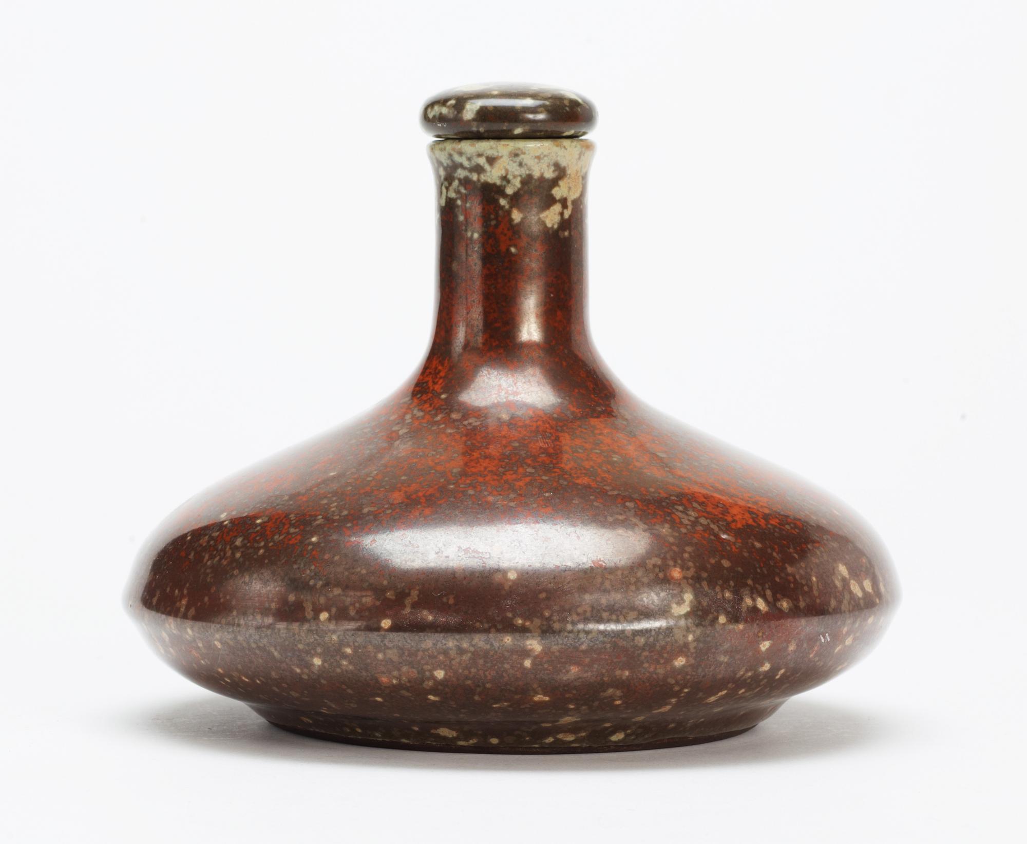 A Hans Hedberg faience bottle with stopper.