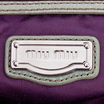 MIU MIU, a green leather shoulder bag.