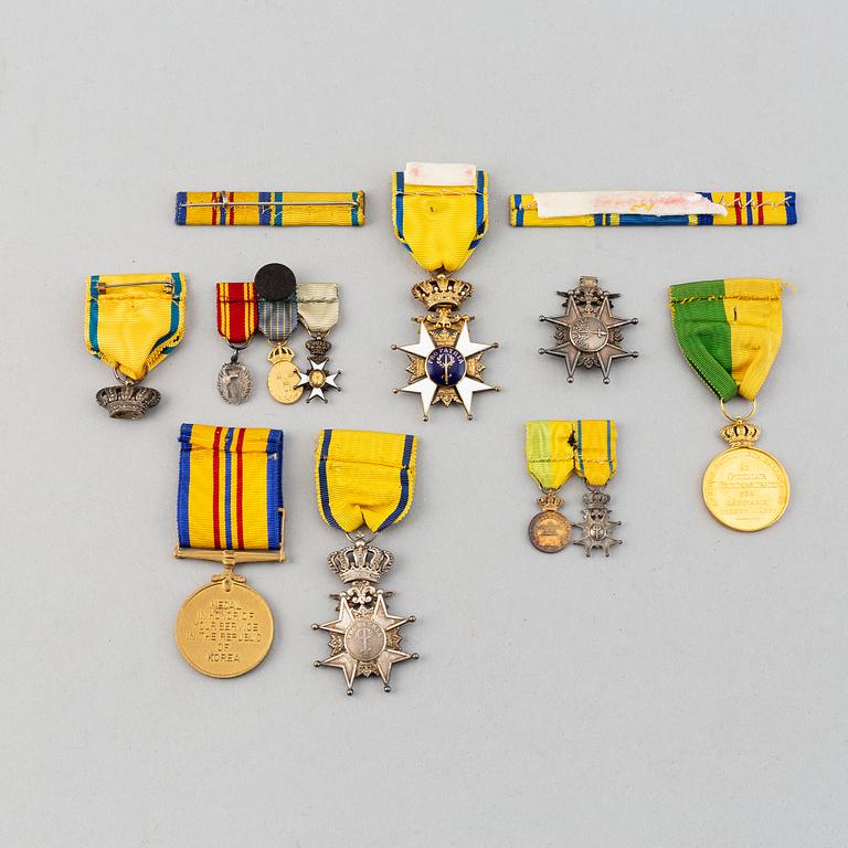 A set of medals and decorations, partly gold.