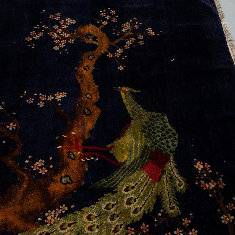 A rug, a semi-antique Baotou figural, ca 206 x 135 cm.